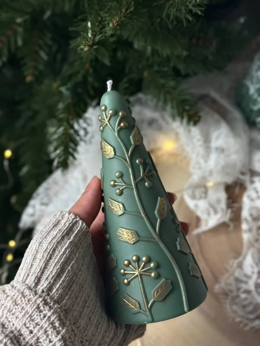 Green Christmas tree candle with gold accents